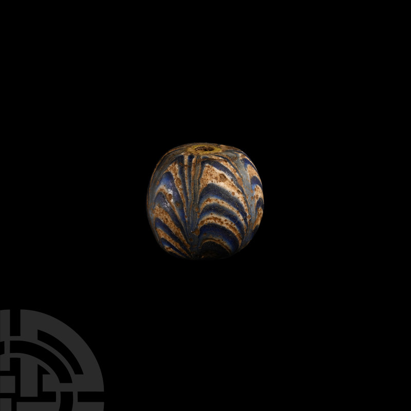 Large Glass Bead
19th-20th century A.D. A large opaque polychrome glass bead di...