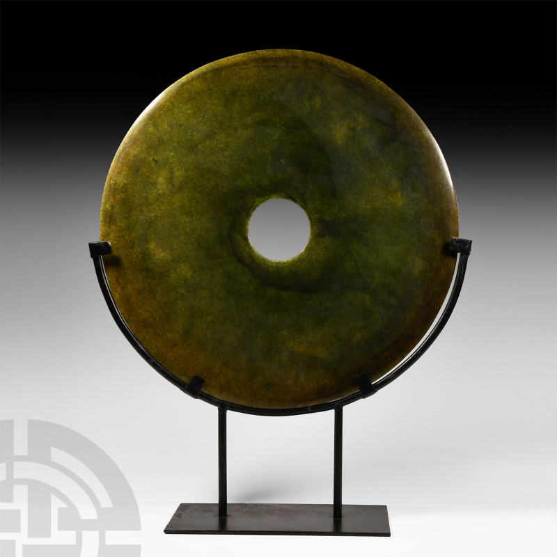 Chinese Green Stone Bi Disc
20th century A.D. or earlier. A large mottled green...