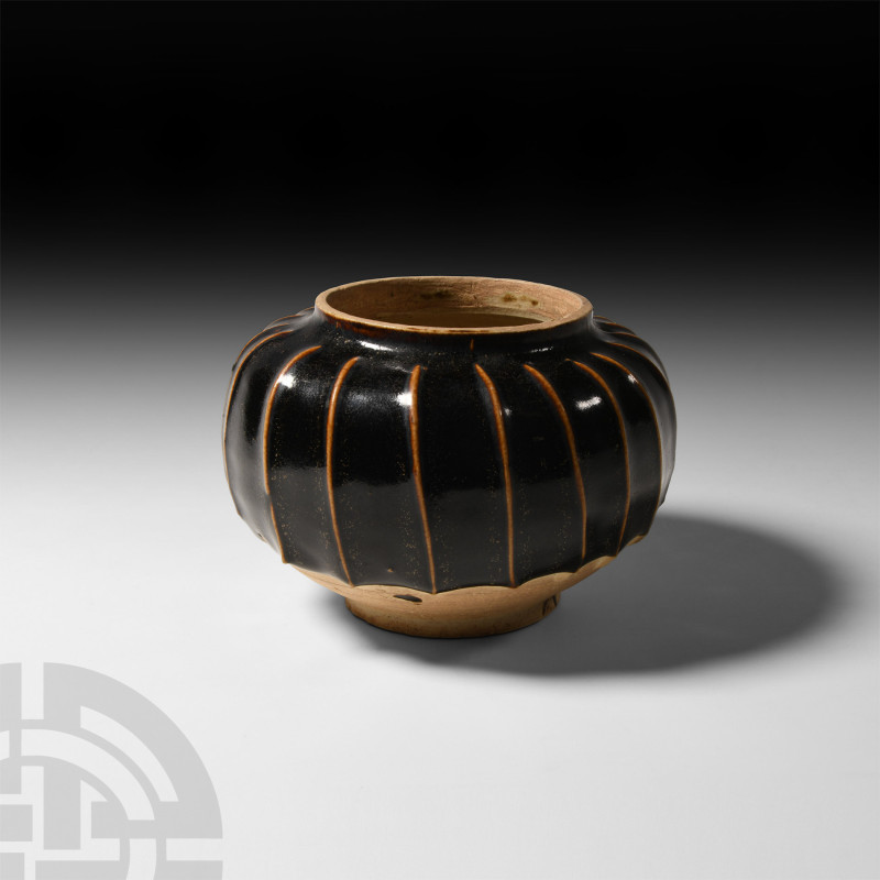 Chinese Cizhou Glazed Jar
20th century A.D. A jar with decorative glaze to the ...