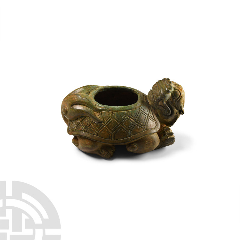 Chinese Han Style Bronze Dragon Turtle
20th century A.D. A copper-alloy vessel ...