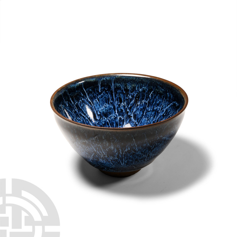 Chinese Blue-Glazed Tea Bowl
20th century A.D. A blue-glazed conical bowl with ...