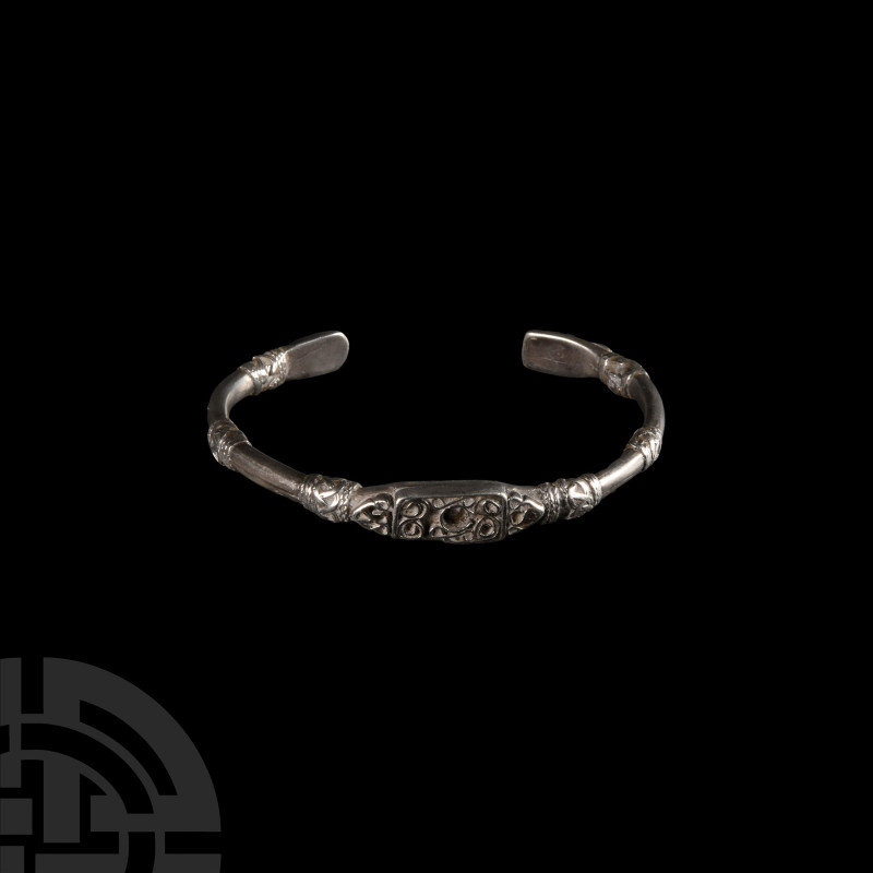 Silver Decorated Bracelet
Circa 19th century A.D. A silver penannular bracelet ...