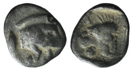 Mysia, Kyzikos, c. 450-400 BC. AR Hemiobol (6mm, 0.25g, 12h). Forepart of boar r.; tunny to l. R/ Head of roaring lion l., retrograde K to l.; all wit...