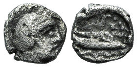 Phoenicia, Arados. Uncertain king, c. 380-351/0 BC. AR Obol (8mm, 0.76g, 6h). Head of marine deity r., wearing laurel wreath. R/ Galley r.; waves belo...