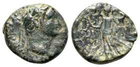 Domitian (81-96). Uncertain mint (Nacrasa?). Æ (18mm, 3.83g, 12h). Laureate head r. R/ Nike standing l., holding wreath and palm branch. Cf. RPC II 93...