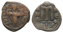 Islamic, Arab-Byzantine, c. 660s-680s. Æ Fals (21.5mm, 5.99g, 1h), Emperor standing facing, holding long cross and globus cruciger. R/ Cursive M; ANA ...
