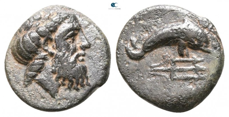 Caria. Mygissos circa 400-300 BC. 
Bronze Æ

8mm., 1,08g.

Laureate, and be...