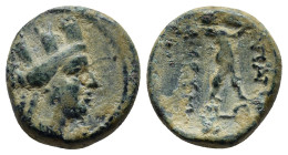 Phrygia, Apameia, c. 88-40 BC. Æ (14mm, 3.7 g). Turreted bust of Artemis–Tyche r., bow and quiver over shoulder. R/ Marsyas advancing r., playing aulo...