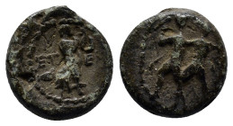 Pisidia. Etenna circa 100 BC. Bronze Æ (12mm, 2.2 g). Nymph advancing right; in front, coiled snake; behind, jug. / Two men standing side by side; the...