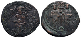 Constantine X. 1059-1067. Æ follis.(27mm, 8.9 g). Christ standing facing on footstool, holding book of Gospels / Eudocia on left and Constantine on ri...