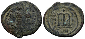 Phocas (602 – 610 AD) Constantinople AE Follis (32mm, 11.4 g) Obv: Phocas and Leontia standing facing, the Emperor holding globus cruciger, the Empres...