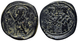 Constantine X. 1059-1067. Æ follis.(28mm, 8.6 g). Christ standing facing on footstool, holding book of Gospels / Eudocia on left and Constantine on ri...