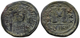 Justinian I, 1 August 527 – 14 November 565 Follis, Nicomedia year 30 (556-557), Æ (33mm, 18.0 g). D N IVSTINI – ANVS PP AVG Helmeted, pearl-diademed ...