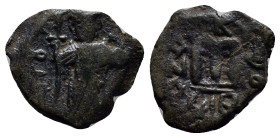 Arab-Byzantine, c. 660s-680s. Æ Fals (17mm, 4.4 g), Emperor standing facing, holding long cross and globus cruciger. R/ Cursive M; ANA to l., NEO to r...