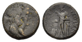 Sicily, Katane, late 3rd century BC. Æ (17,5 mm, 4,9 g). Jugate busts of Serapis and Isis; grain-ear behind. R/ Apollo standing slightly l., leaning o...