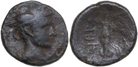 Sicily, Katane, c. 200 BC. Æ (20 mm, 7 g). Head of Hermes r., wearing winged petasos. R/ Nike advancing l., holding wreath and palm; two monograms to ...