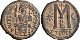 Justinian I, 527-565. Follis (Bronze, 32 mm, 16.14 g, 5 h), Theoupolis (Antiochia), 529-533. D N IVSTINIANVS P P AVS Justinian enthroned facing, holdi...