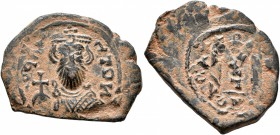 ISLAMIC, Time of the Rashidun. Pseudo-Byzantine types. Circa AH 37-55 / AD 658-675. Fals (Bronze, 25 mm, 5.31 g, 11 h), probably imitating a follis of...