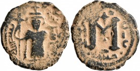 ISLAMIC, Umayyad Caliphate. temp. Mu'awiya I ibn Abi Sufyan , AH 41-60 / AD 661-680. Fals (Bronze, 23 mm, 5.15 g, 12 h), Arab-Byzantine type, Hims. Im...