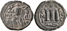 ISLAMIC, Umayyad Caliphate. temp. Mu'awiya I ibn Abi Sufyan , AH 41-60 / AD 661-680. Fals (Bronze, 22 mm, 4.26 g, 7 h), Arab-Byzantine type, Hims. K/A...