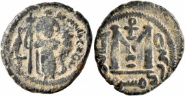 ISLAMIC, Umayyad Caliphate. temp. Mu'awiya I ibn Abi Sufyan , AH 41-60 / AD 661-680. Fals (Bronze, 19 mm, 4.21 g, 4 h), Arab-Byzantine type, Dimashq. ...