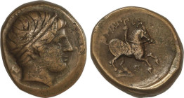 AE 18. 359-336 a.C. FILIPO II. MACEDONIA. Anv.: Cabeza diademada de Apolo a derecha. Rev.: Jinete a derecha, encima leyenda poco visible. 6,63 grs. AE...