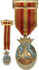 Ifni-Sahara. 1958. Estado Español. Metal y esmaltes al fuego. Ø 52 x 31 mm. Con corona imperial solidaria, cinta y prendedor. Medalla para suboficiale...
