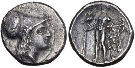 Southern Lucania, Herakleia, c. 281-278 BC. AR Stater (21mm, 7.41g). Head of Athena r., wearing crested Corinthian helmet decorated with Skylla hurlin...