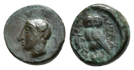 Sicily, Kamarina, c. 420-405 BC. Æ Tetras (14mm, 3.50g). Helmeted head of Athena l. R/ Owl standing l., head facing, clutching lizard with r. talon. C...
