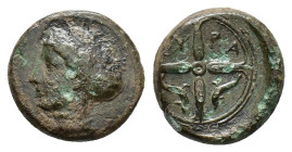 Sicily, Syracuse, c. 415-405 BC. Æ Hemilitron (15mm, 3.01g). Head of Arethusa l., hair in sphendone. R/ Wheel of four spokes; dolphins in lower quarte...