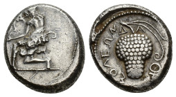 Cilicia, Soloi, c. 440-410 BC. AR Stater (21.5mm, 10.51g). Amazon kneeling l., with bowcase at hip, stringing bow. R/ Grape bunch on vine with tendril...