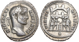 Diocletian (284-305). AR Argenteus (18.5mm, 3.49g). Rome, c. 295-7. Laureate head r. R/ The four tetrarchs sacrificing before a camp-gate with four tu...