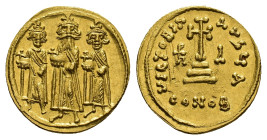 Heraclius (610-641). AV Solidus (19.5mm, 4.50g). Constantinople, 638/9-641. Heraclonas, Heraclius and Heraclius Constantine standing facing, each hold...