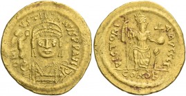 Justin II, 15 November 565 – 5 October 578. Solidus 565-578, AV 4.43 g. D N I – VSTI – NVS PP AVG Helmeted, pearl-diademed and cuirassed bust facing, ...