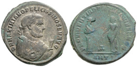 Maximianus. Follis. 306 AD. Antioch. (Ric-77b). Anv.: D N MAXIMIANO BAEATISSIMO SEN AVG, laureate bust of Maximianus right, wearing imperial mantle, h...