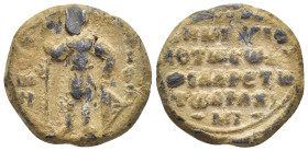 Byzantine lead seal. (24mm, 12.62 g) Obv: Saint standing, in armor and a cloak, holding a spear in his right hand and a shield with his left. Rev: Leg...