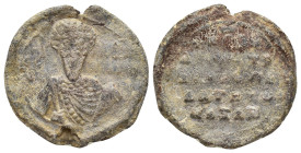 Byzantine Lead Seal (23mm, 6.00 g). Nimbate facing bust of Saint, holding spear over his right shoulder and resting shield on his left arm. Rev. Legen...