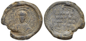 Byzantine Lead Seal (27mm, 12.41 g). Nimbate facing bust of Saint, holding spear over his right shoulder and resting shield on his left arm. Rev. Lege...