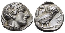 ATTICA. Athens.(Circa 454-404 BC).Tetradrachm.

Obv : Helmeted head of Athena to right.

Rev : AΘE.
Owl standing right, head facing; olive sprig and c...