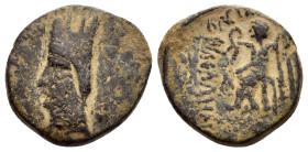 KINGS of ARMENIA. Tigranes I.(123-96 BC).Ae. 

Obv : Head left, wearing tall turreted tiaran.

Rev : Zeus Nikephoros seated left, holding wreath and s...