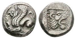 Troas, Assos. AR Drachm, 3.75 g 13.37 mm. Circa 500-450 BC. 
Obv: Griffin seated left; tongue out.
Rev: Lion head right, prominent teeth and tongue ou...