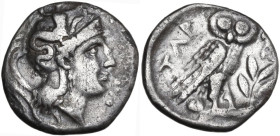 Greek Italy. Southern Apulia, Tarentum. AR Drachm, c. 302-280 BC. Obv. Head of Athena right, wearing helmet decorated with Scylla. Rev. Owl standing r...