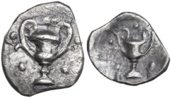 Greek Italy. Southern Apulia, Tarentum. AR Obol, C. 280-228 BC. Obv. Kantharos surrounded by five pellets. Rev. Kantharos surrounded by five pellets. ...