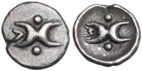 Greek Italy. Southern Apulia, Tarentum. AR Hemiobol, c. 280-228 BC. Obv. Two crescents back-to-back; two pellets around; to left, A. Rev. Two crescent...