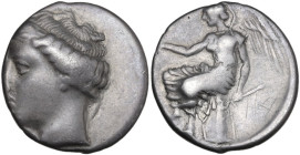 Greek Italy. Bruttium, Terina. AR Nomos, c. 440-425 BC. Obv. [TEPINAION]. Head of female (the nymph Terina?) left, wearing ampyx. Rev. Nike seated lef...