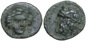Sicily. Gela. AE 14.5 mm, c. 315-310 BC. Obv. Head of Demeter facing slightly right, wearing wreath of grain. Rev. Head of Gelas left, horned, wearing...