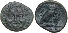 Sicily. Kamarina. AE Tetras, c. 420-405 BC. Obv. Gorgoneion facing. Rev. Owl standing right, head facing, grasping lizard; three pellets in exergue. H...