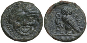 Sicily. Kamarina. AE Tetras or Trionkion, c. 420-405 BC. Obv. Gorgoneion. Rev. KAMA. Owl standing left, head facing, grasping lizard; three pellets in...