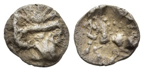 CENTRAL EUROPE. Vindelici. 1/4 Quinarius (1st century BC). "Manching" type. 

Obv: Stylized head right, wearing mask(?).
Rev: Stylized horse prancing ...