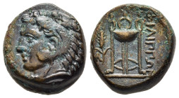 MACEDON. Philippi. Ae (Circa 356-345 BC).

Obv: Head of Herakles left, wearing lion-skin headdress. 
Rev: Tripod; to left, grain ear and M.

 AMNG III...